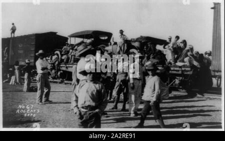 Railroad trains transporting Insurrectos during the Mexican Revolution: With 2 automobiles on car Stock Photo