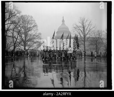 Rain fails to mar Army Day parade in Capitol. Washington, D.C., April 6. With the United States rearming and rumors of war in the air thousands braved a heavy rain today to witness the Army Day parade pass the U.S. Capitol. The parade marked the 22nd anniversary of America's entrance into the World War. 4-6- 39 Stock Photo
