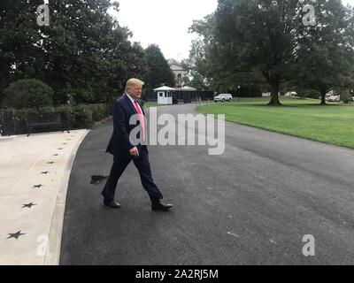 Washington, District of Columbia, USA. 3rd Oct, 2019. President DONALD TRUMP walks out of The White House to the South Lawn to speak to the press for 7 minutes before departing on Marine One to Joint Base Andrews (JBA) to fly to Florida, Oct. 3, 2019 Credit: Douglas Christian/ZUMA Wire/Alamy Live News Stock Photo