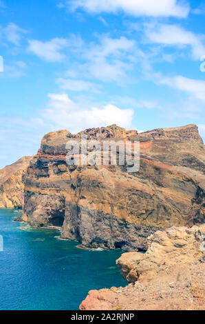 Stunning cliffs in Ponta de Sao Lourenco, Madeira Island, Portugal captured on vertical picture. The easternmost point of the island of Madeira, volcanic landscape by the Atlantic ocean. Stock Photo