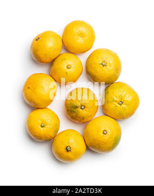 Fresh yellow tangerines isolated on white background. Stock Photo
