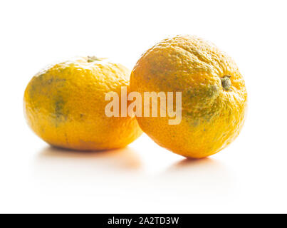 Fresh yellow tangerines isolated on white background. Stock Photo