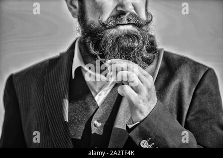Guy cigarette enjoy nicotine influence. Cigarettes help us with everything  from boredom to anger management. Man with beard mustache hold cigarette.  Bearded hipster smoking cigarette sky background Stock Photo