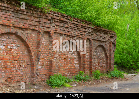 Red brick old wall part of an ancient structure Stock Photo