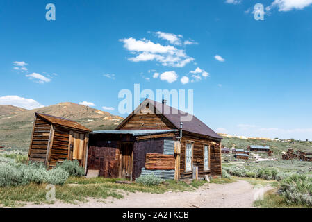Abandoned house with lean-to shed at Bodie State Historic Park, an old California mining camp and boom town in the eastern Sierra. It's now a National Stock Photo