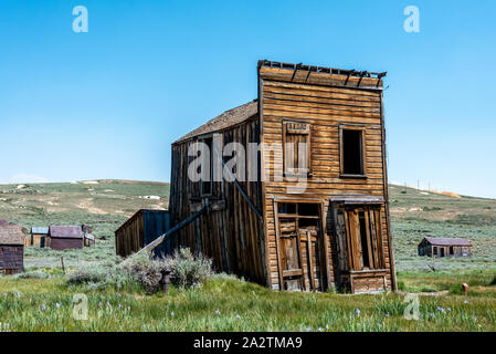Swazey Hotel, a leaning old wooden building at Bodie State Historic Park and ghost town. Stock Photo