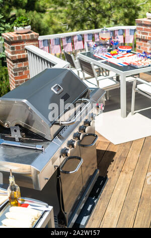 Hot dog bar with corn on the cob for July 4th celebration on the back patio. Stock Photo