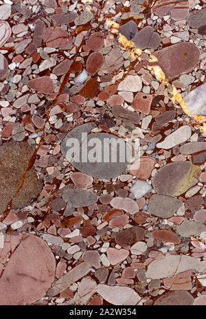 Backgrounds and textures: surface of beautiful pink decorative stone, abstract pattern of cracks, spots and stains, natural background Stock Photo