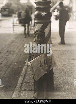 A Little Shaver, Indianapolis Newsboy, 41 inches high. Said he was 6 years old. Aug. 1908. Wit. E.N. Clopper. Location: Indianapolis, Indiana., Lewis Wickes Hine, Photographer (American, 1874-1940), about 1920, gelatin silver print affixed to artist's mount, 9-1/2 x 7-5/8 in. (sheet), Typed on label, verso, c: PEOPLE CALL HIM A LITTLE SHAVER. SIX/YEARS OLD AND FORTY-ONE INCHES HIGH--HE/STANDS FOR AN ARMY OF LITTLE NEWSIES THE/COUNTRY OVER/Street Trades/N-105/Indianapolis, Ind./August 1908/Photo-Study by Lewis W. Hine. Stamped, verso, u.c.: LEWIS W. HINE/INTERPRETIVE PHOTOGRAPHY/HASTINGS-ON- Stock Photo