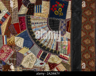 crazy quilt, Unknown, about 1885, silk, velvet, ribbons, synthetic fabric, pieced and embroidered, 85-1/2 x 81-3/4 in., American, Textile and Fashion Arts Stock Photo