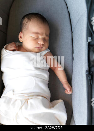 2 week old baby in bassinet Stock Photo