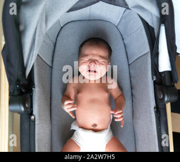 2 week old baby in bassinet Stock Photo