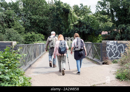 People walking along the Parkland Walk a disused railway line now an urban nature reserve, London Borough of Haringey England Britain UK Stock Photo