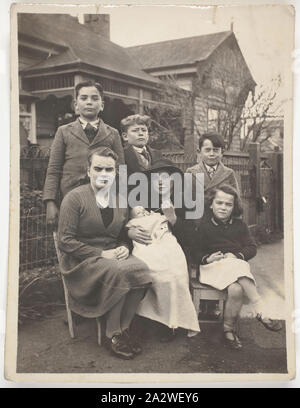 Digital Photograph - Hasegawa Family in Front of a House, Geelong, circa 1940s, Photograph of some members of the Hasegawa family taken in Geelong. It is likely that this is Leo Hasegawa's wife Edna (Ida) and their children. Leo was the first of Setsutaro's three children to marry, in 1929, this date combined with the age of the children make it likely that the photograph was taken in the late 1930s or early 1940s. Setsutaro Hasegawa migrated to Australia in 1897 at the age Stock Photo