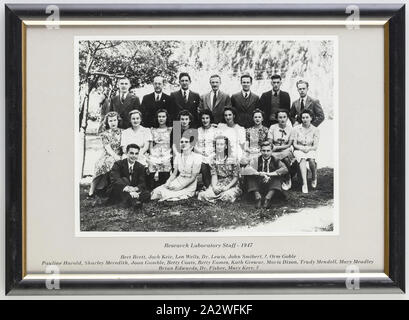 Photograph, Kodak Research Laboratory Staff, Abbotsford, Victoria, 1947-1948, Framed, black and white silver gelatin photograph of staff from the Research Laboratory at Kodak Australasia factory, Abbotsford, Victoria, 1947-1948. Standing in the back row from left to right: Bert Brett, Jock Keir, Len Wells, Dr Lewis, John Smibert, [unidentified], Orm Goble. Seated in the middle row from left to right: Pauline Harrold, Sharley Meredith, Joan Gamble, Betty Coats, Betty
