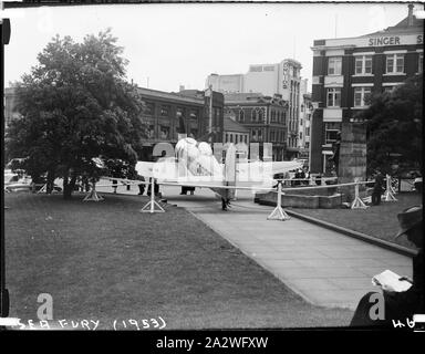 Glass Negative - Sea Fury Military Bomber Aircraft, Museum of Applied Science of Victoria (Science Museum), Melbourne, 1953, Photograph showing rear view of the Royal Australian Navy's Sea Fury Aircraft outside the Museum of Applied Science of Victoria, corner of Swanston and Bourke Street, 1953. The Sea Fury was loaned by the Royal Australian Navy for the Jubilee of Flight Exhibition. The exhibition commemorated fifty years of aviation, and was open from Dec 10 1953 to Feb 1954 Stock Photo