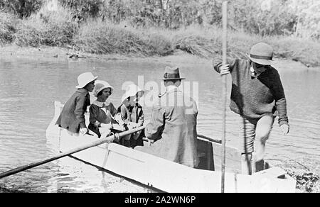Negative - Man, Woman & Three Small Children in a Rowboat on Barcoo River, 'Portland Downs' Station, Isisford District, Queensland, circa 1915, A man, woman and three small children in a rowboat on the Barcoo River on 'Portland Downs' station Stock Photo