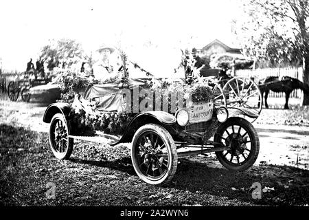 Negative - Victoria, circa 1915, A model T Ford car decorated for a procession (?). A sign on the front says 'For God and Country Stock Photo