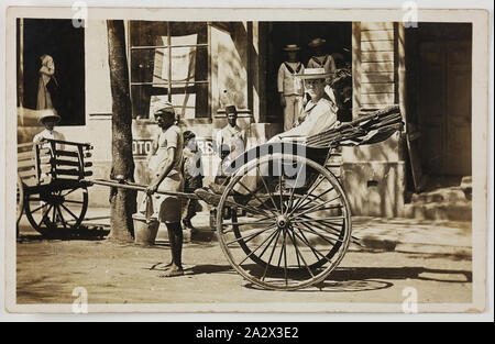 Photograph - HMAS Australia, Seaman in a Rickshaw, Colombo, 1914 -1918, One of 63 postcards contained in an album that was owned by Cliff Nowell. There are 25 postcards mounted inside the album and 38 postcard held loosely with in it, (loose postcards housed separately). The images depict photographs of sailors from HMAS Australia and of family and friends. It also conatins a mixture of hand-painted cards (two), original photographs Stock Photo