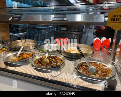 Orlando,FL/USA-10/2/19: Panda Express chinese fast food restaurant entrees behind a glass enclosed counter. Stock Photo