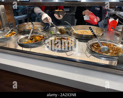 Orlando,FL/USA-10/2/19: Panda Express chinese fast food restaurant employees waiting on customers. Stock Photo