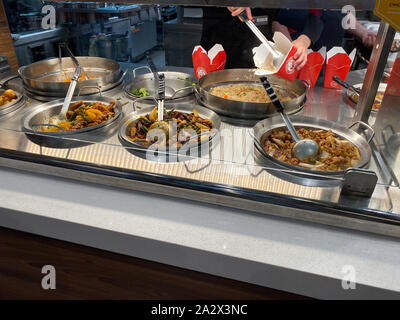 Orlando,FL/USA-10/2/19: Panda Express chinese fast food restaurant employees waiting on customers. Stock Photo