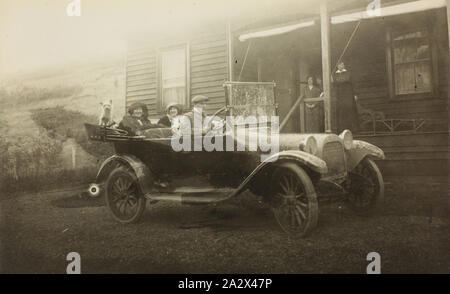 Photograph - Dodge Motor Car with Passengers, Goulburn Valley, Victoria, 1916-1918, Black and white photograph of a group of people in a mud splattered Dodge motor car, 1916-1918. It is part of a large photographic collection of glass plate and film negatives, photographic prints and photo albums, relating to the development of the electric power supply industry in Victoria, operated by the State Electricity Commission of Victoria (SECV) from 1919 to 1993 and various predecessor Stock Photo