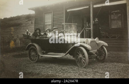 Photograph - Dodge Motor car with Passengers, Goulburn Valley, Victoria, 1916-1918, Black and white photograph of a group of people in a mud splattered Dodge motor car, 1916-1918. It is part of a large photographic collection of glass plate and film negatives, photographic prints and photo albums, relating to the development of the electric power supply industry in Victoria, operated by the State Electricity Commission of Victoria (SECV) from 1919 to 1993 and various predecessor Stock Photo