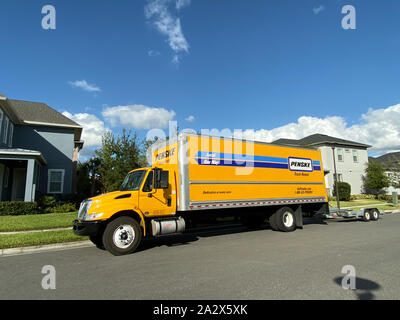 Orlando,FL/USA-10/3/19: A Penske Rental truck used to move a family to a new home.  Penske Truck Rental is a privately held company owned by Penske Co Stock Photo