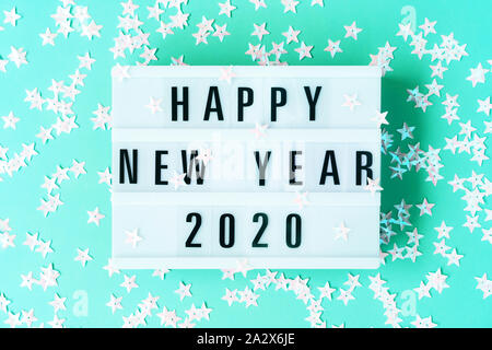 Glowing light box with the inscription Happy New Year 2020 Stock Photo