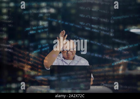 Stressed out student while coding. Programmer getting frustrated. Web developer feeling angry. Random HTML codes web development. Stock Photo