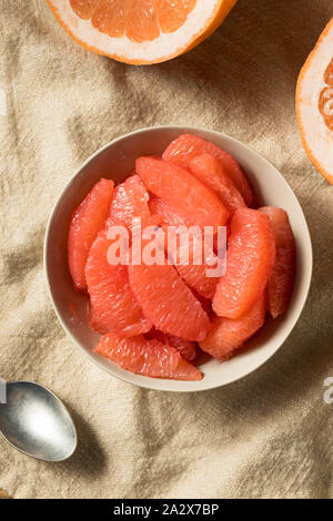 Raw Red Organic Grapefruit Slices in a Bowl Stock Photo