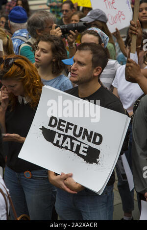 'Close The Camps' and 'Defund ICE' rally at the NY Public Library and march to a Microsoft Store on 5th Avenue where arrests were made for blocking the entrance. Microsoft does business with ICE. Manhattan, NYC. Stock Photo