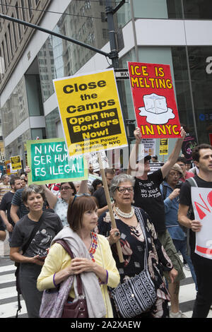 'Close The Camps' and 'Defund ICE' rally at the NY Public Library and march to a Microsoft Store on 5th Avenue where arrests were made for blocking the entrance. Microsoft does business with ICE. Manhattan, NYC. Stock Photo