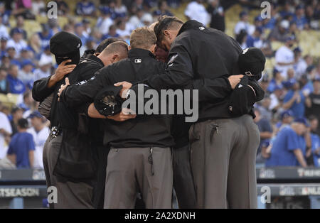 Los Angeles, United States. 03rd Oct, 2019. Umpires gather before the first game of the MLB National League Division Series between the Washington Nationals and the Los Angeles Dodgers at Dodger Stadium in Los Angeles, California on Thursday, October 3, 2019. Photo by Jim Ruymen/UPI Credit: UPI/Alamy Live News Stock Photo