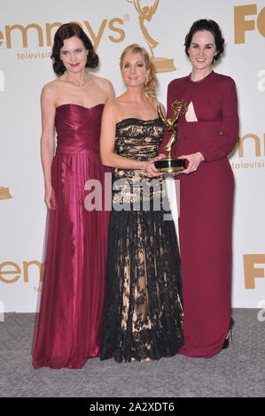 LOS ANGELES, CA. September 18, 2011: Downton Abbey stars Elizabeth McGovern (left), Joanne Froggatt & Michelle Dockery in the press room at the 2011 Primetime Emmy Awards at the Nokia Theatre L.A. Live in downtown Los Angeles. © 2011 Paul Smith / Featureflash Stock Photo