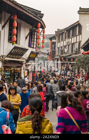 Chongqing, China, 21 Nov 2012: Huge crowd in ancient city of Ciqikou with historical shophouses. Stock Photo