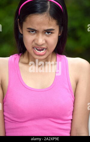 An Anxious Beautiful Filipina Female Youngster Stock Photo