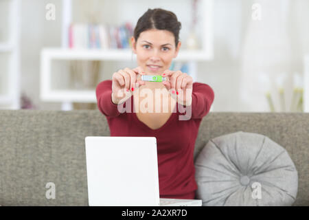 woman hand holding usb flash memory stick Stock Photo