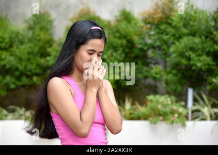 A Young Asian Juvenile And Disappointment Stock Photo