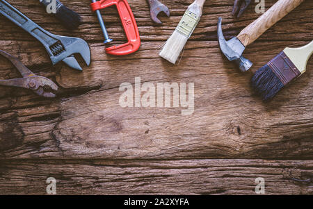 Set of rusty hand tools renovation on grunge wood. copyspace image. construction instrument background with blank space concept. Stock Photo