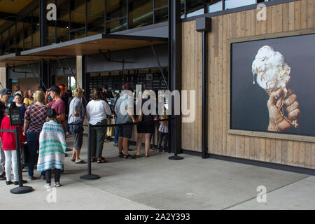 Visitors line up at the ice cream counter in the Tillamook Creamery, a visitor center at Tillamook Cheese Factory in Oregon, on Saturday, Aug 31, 2019. Stock Photo