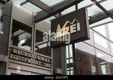 The REI sign at the entrance of its store in Portland. Recreational Equipment, Inc. is an American retail and outdoor recreation services corporation. Stock Photo