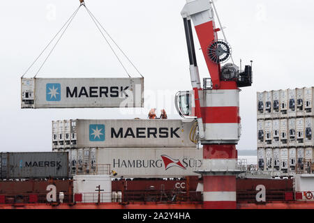 Crane unloads container ship Sevmorput - Russian nuclear-powered icebreaker lighter aboard ship carrier. Container terminal seaport. Pacific Ocean Stock Photo