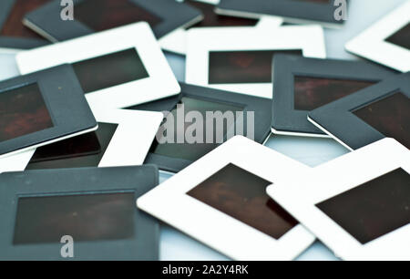 old slide projector film stack on white background Stock Photo