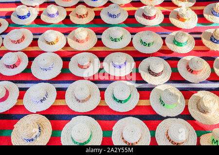 Many summer hats made of sisal ropes as souvenirs Stock Photo