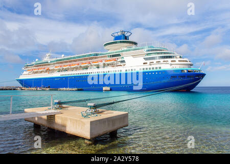 Large blue passenger ship  anchored on coast of Bonaire Stock Photo