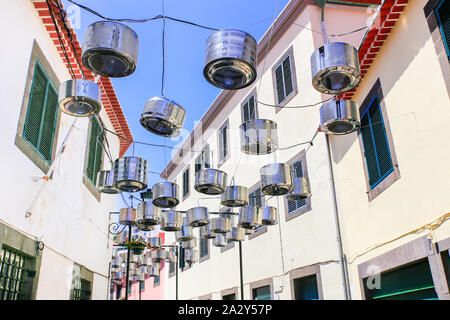 Decorated city street between white houses in Portugal Stock Photo