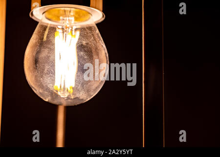 Light bulb glowing in the dark Stock Photo