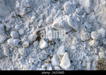 Chunks of dirty snow with some sand mixed with it. You will get snow chunks like these after snow removal outdoors. Photographed in Finland. Stock Photo